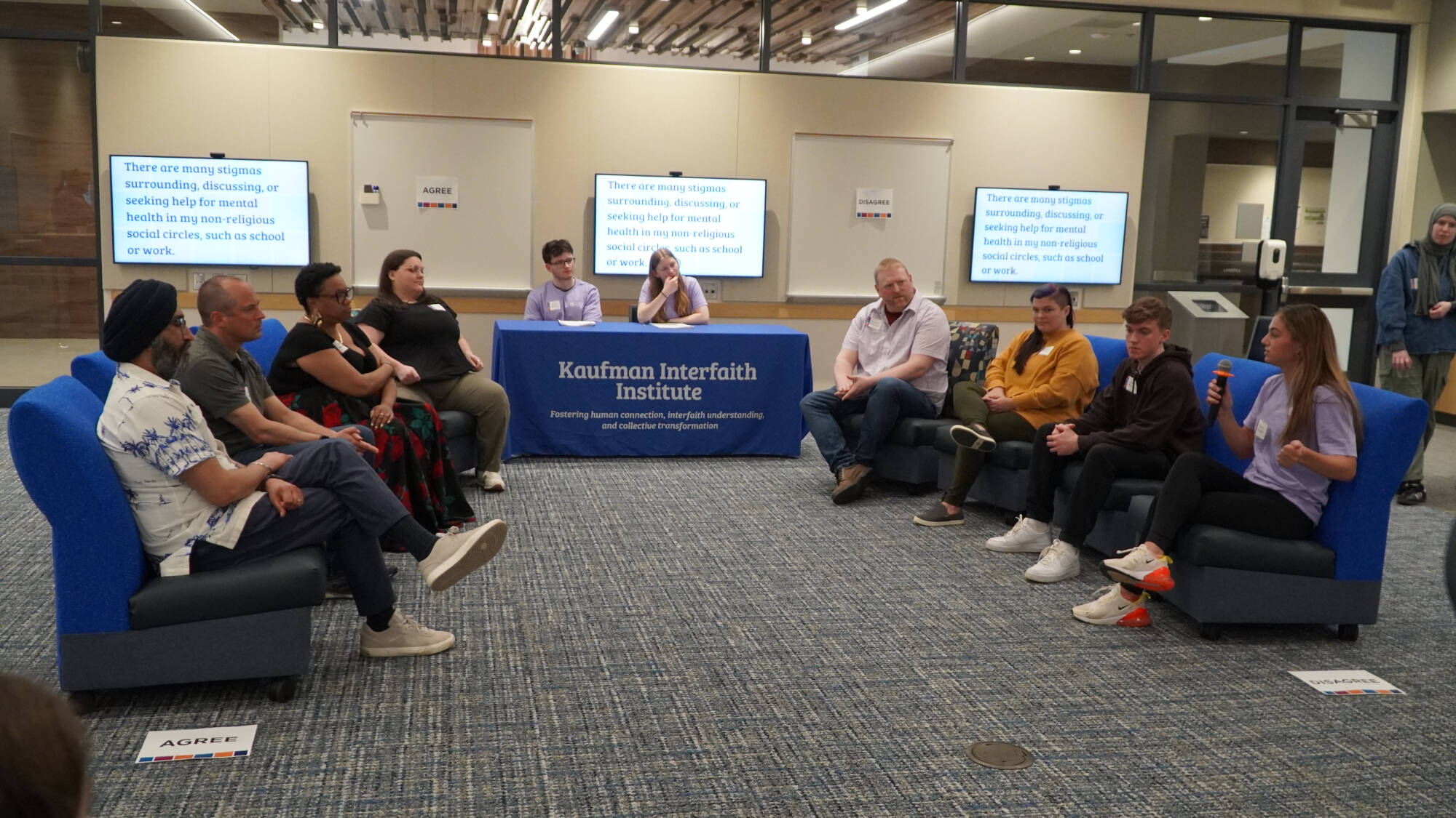 scholars facilitate a community event on mental health